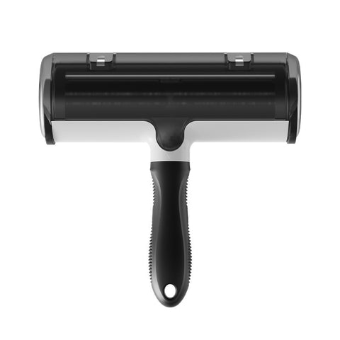 Black reusable pet hair remover roller lifting fur from fabric