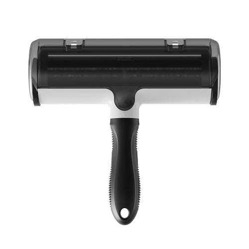 Black reusable pet hair remover roller lifting fur from fabric