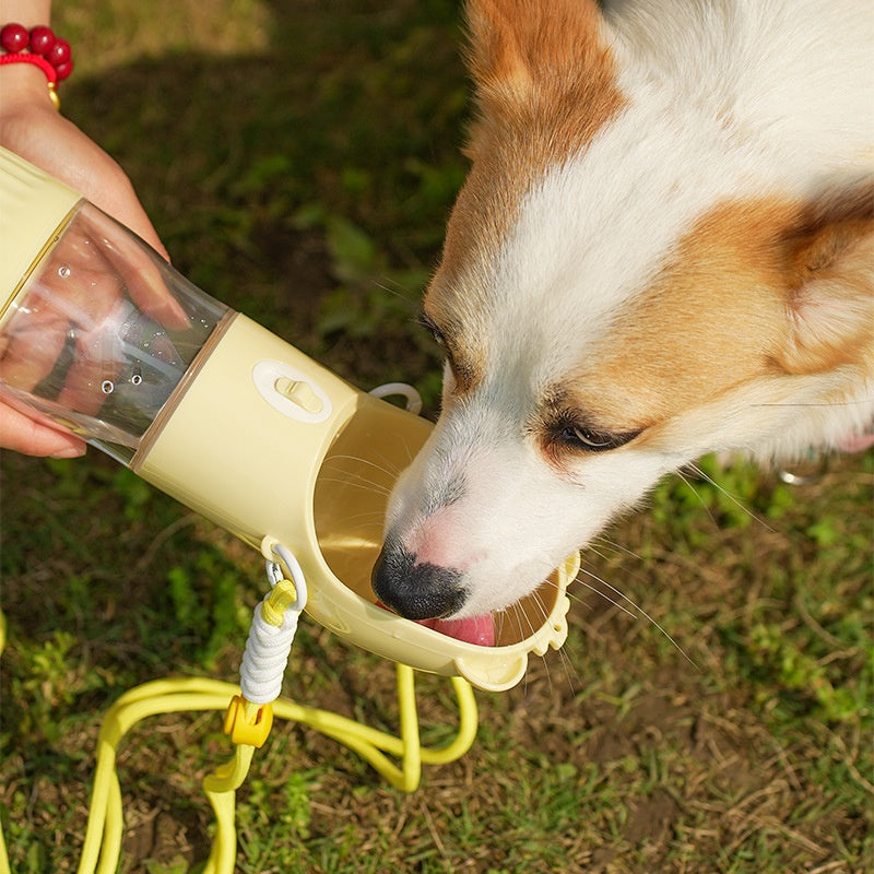 Yellow portable dog water bottle with flip-up drinking bowl
